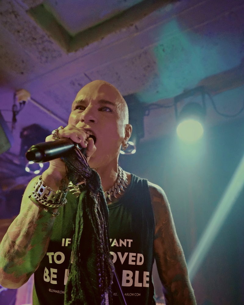 Kelly Marlow live on stage wearing the If You Want To Be Loved tank top