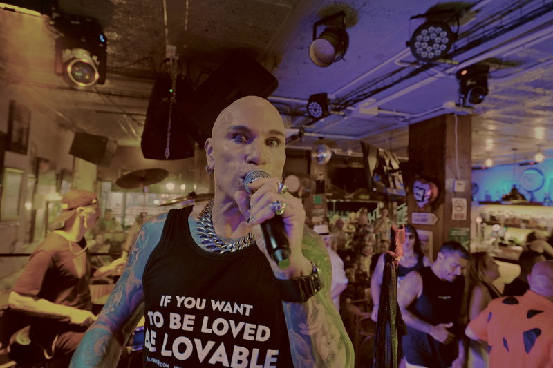 Kelly Marlow singing in the crowd with the signature If You Want To Be Loved design