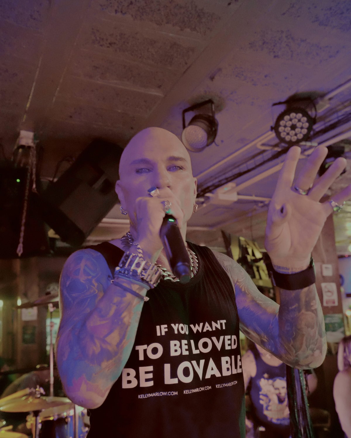 Kelly Marlow live on stage wearing this exact "If You Want To Be Loved" tank top